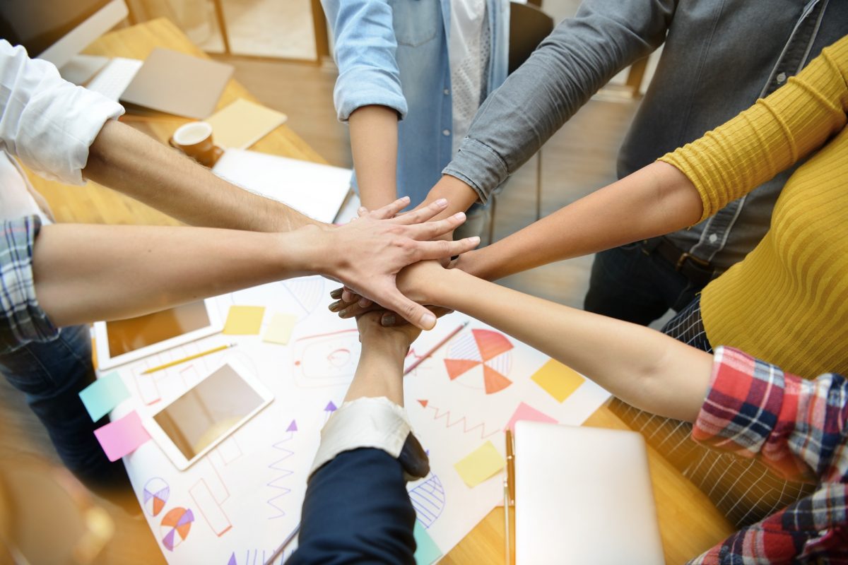 Hands of group of businesspersons showing teamwork